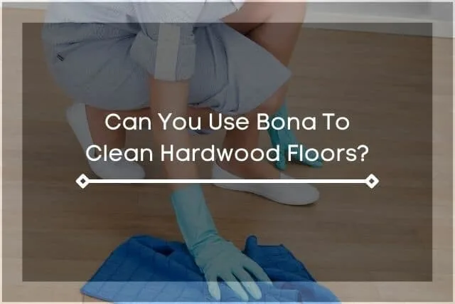 Woman kneeling on ground with towel wiping hardwood floor