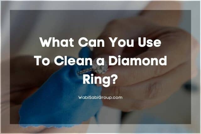 Hands wiping clean a diamond ring with cloth