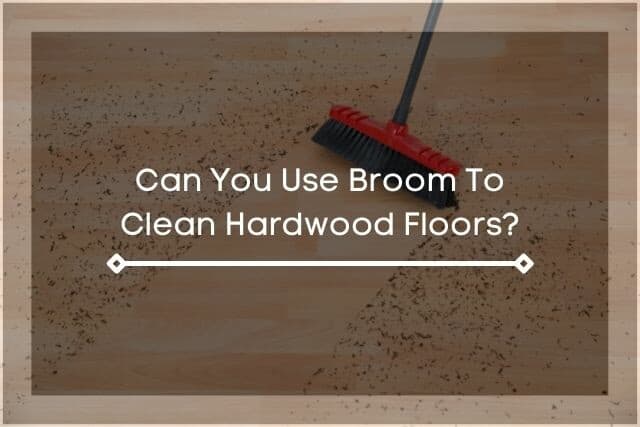 A red broom sweeping dirt off hardwood floor