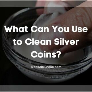 Cleaning a silver coin in a bowl of baking soda solution