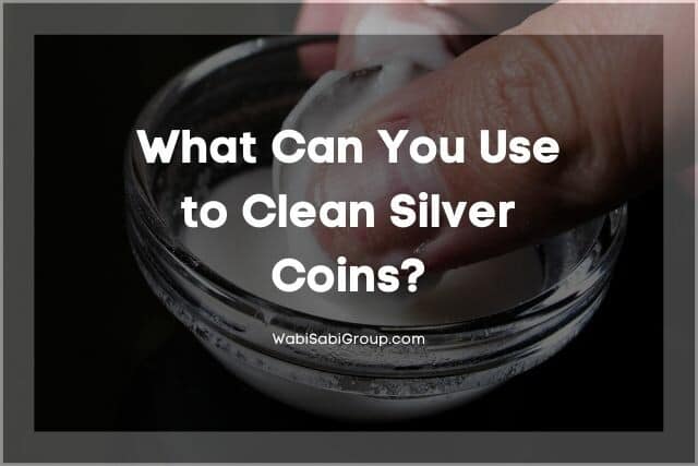 Cleaning a silver coin in a bowl of baking soda solution