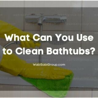 Cleaning gloves wiping down bathtub