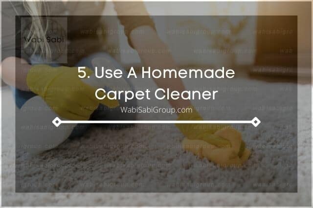 Spraying and hand scrubbing carpet