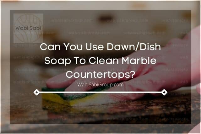 A photo of a person's hand cleaning the marble countertop with sponge and dishwashing soap