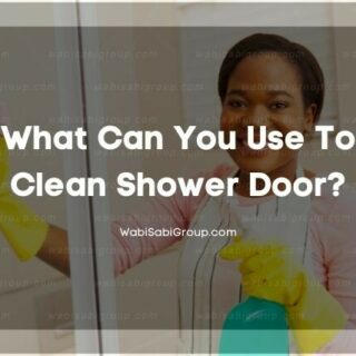 A photo of a cleaner cleaning shower doors